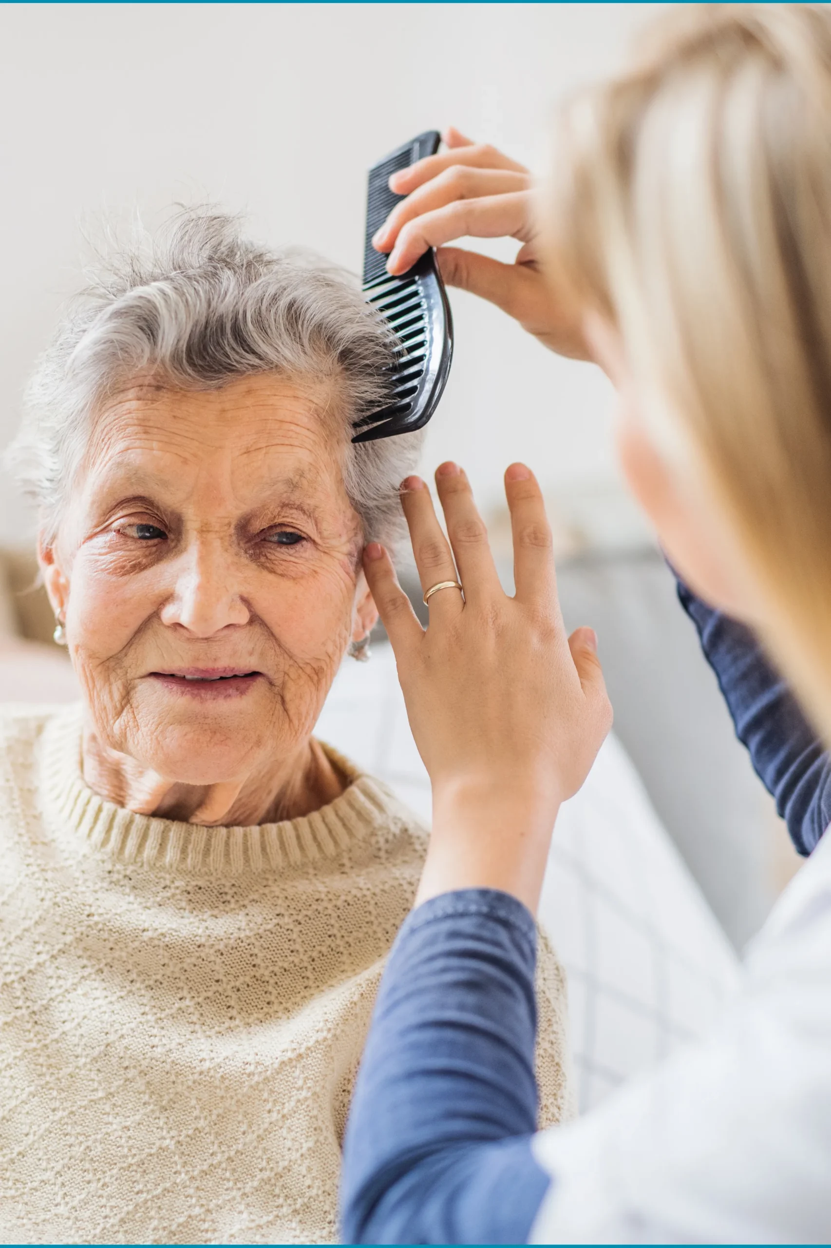 a-health-visitor-combing-hair-of-senior-woman-at-h-2021-08-26-12-09-30-utc